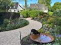 Tuin met slingerpad - poes